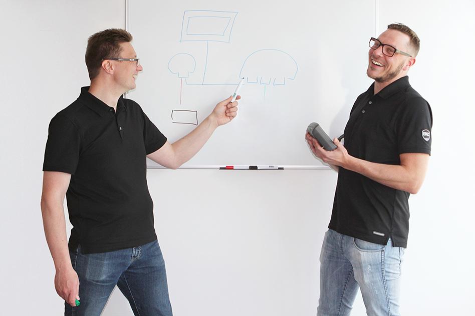 JP Lehto (on the left) and Raine Röyskö (on the right) demonstrating a system wireframe.